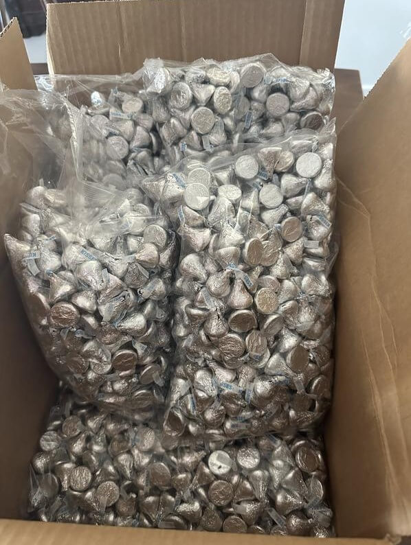 Opening the Hershey's Kisses bulk box showing wrapped chocolates